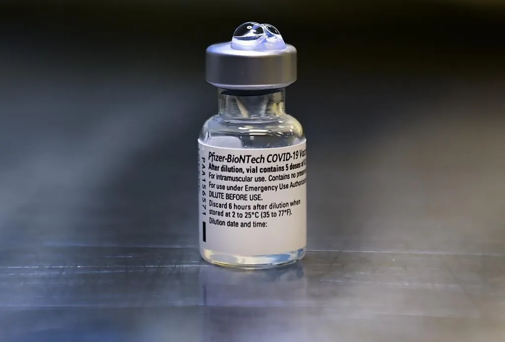 A vial of the Pfizer-BioNTech COVID-19 vaccine is shown at a UHN COVID-19 vaccine clinic in Toronto on Jan. 7, 2021. (The Canadian Press/Nathan Denette)