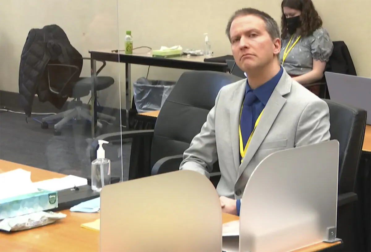 In this image from video, former Minneapolis police Officer Derek Chauvin listens as his defense attorney Eric Nelson gives closing arguments as Hennepin County Judge Peter Cahill preside in the trial of Chauvin at the Hennepin County Courthouse in Minneapolis, Minn., on April 19, 2021. (Court TV via AP)