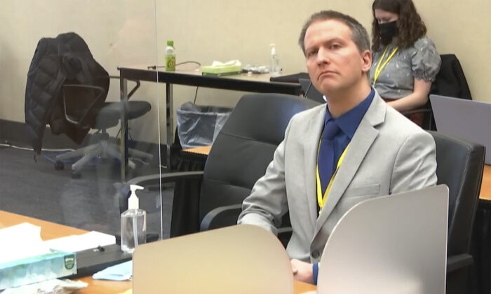 In this image from video, former Minneapolis police Officer Derek Chauvin listens as his defense attorney Eric Nelson gives closing arguments as Hennepin County Judge Peter Cahill preside in the trial of Chauvin at the Hennepin County Courthouse in Minneapolis, Minn., on April 19, 2021. (Court TV via AP)