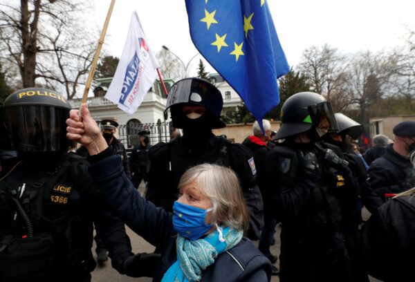 A woman waves a European Union flag