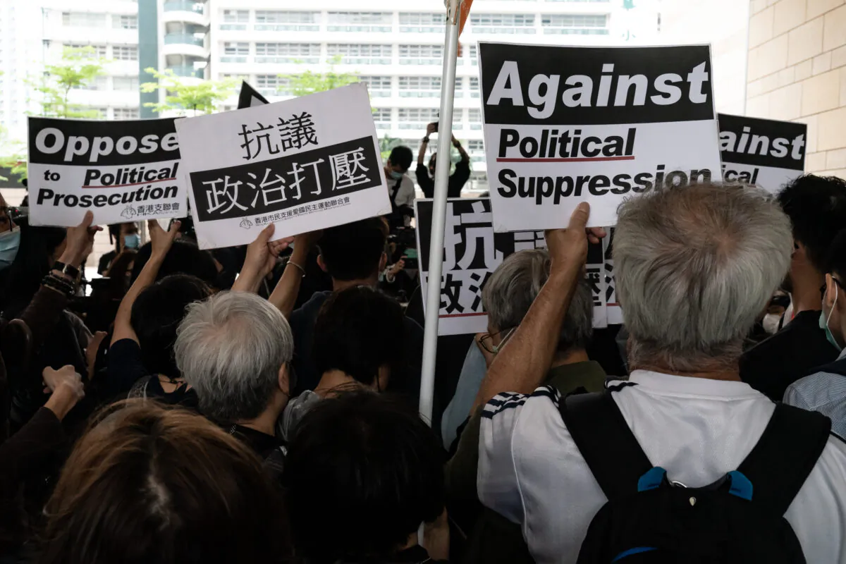 Supporters hold placards at West Kowloon court ahead of a sentencing hearing on April 16, 2021 in Hong Kong (Anthony Kwan/Getty Images)