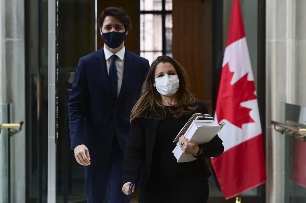 Prime Minister Justin Trudeau and Finance Minister Chrystia Freeland make their way to hold a press conference in Ottawa on April 20, 2021. (The Canadian Press/Sean Kilpatrick)