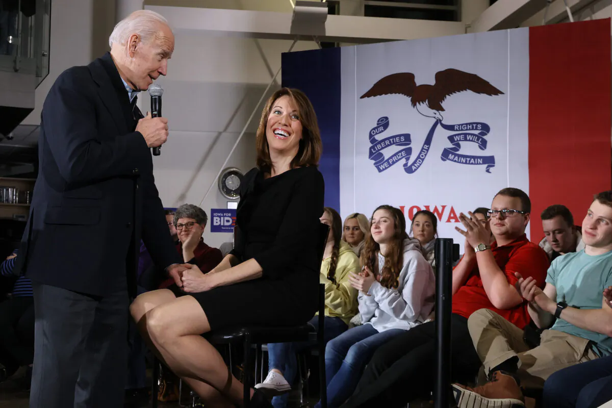 Then presidential candidate and now President Joe Biden (L) is joined by Rep. Cindy Axne (D-Iowa) during a town hall meeting in Ankeny, Iowa, on Jan. 25, 2020. (Chip Somodevilla/Getty Images)