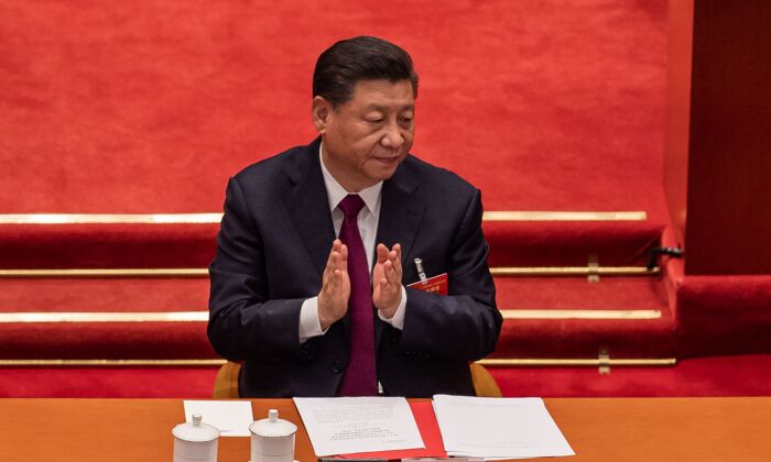 Chinese Communist Party leader Xi Jinping applauds during the closing session of the National Peoples Congress at the Great Hall of the People in Beijing on March 11, 2021. (Nicolas Asfouri/AFP via Getty Images)