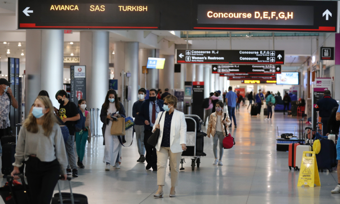 Travelers walk through Miami International Airport, Fla., on Feb. 1, 2021. (Joe Raedle/Getty Images)