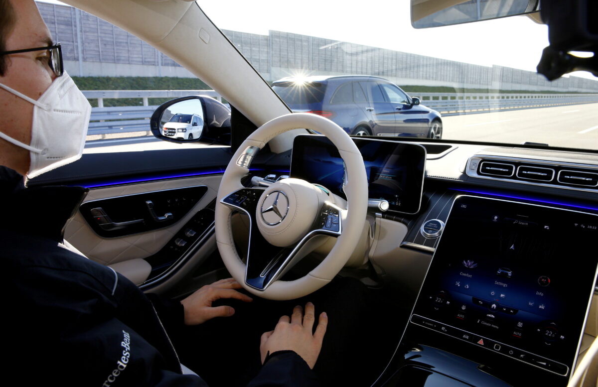 Employees demonstrate autonomous driving system steering at the new Mercedes-Benz S-Class limousine near Immendingen