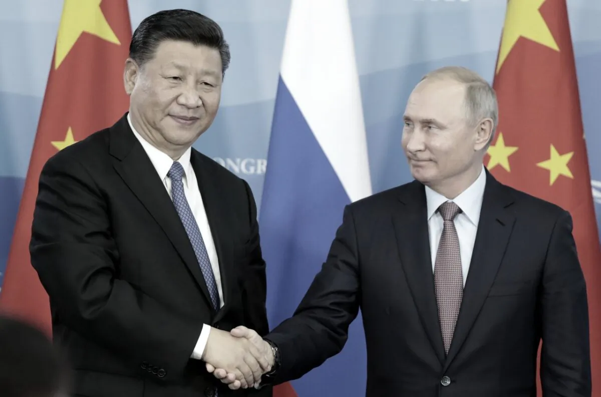 Russian President Vladimir Putin (R) shakes hands with Chinese leader Xi Jinping during a signing ceremony following the Russian-Chinese talks on the sidelines of the Eastern Economic Forum in Vladivostok on Sept. 11, 2018. (Sergei Chirikov/AFP/Getty Images)