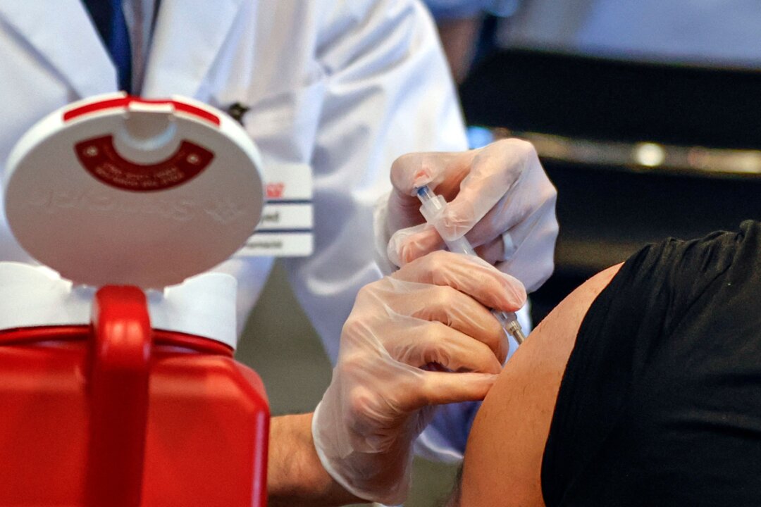 A man receives the Johnson & Johnson COVID-19 vaccine at a site in Chicago, Ill., on April 6, 2021. (Kamil Krzaczynski/AFP via Getty Images)