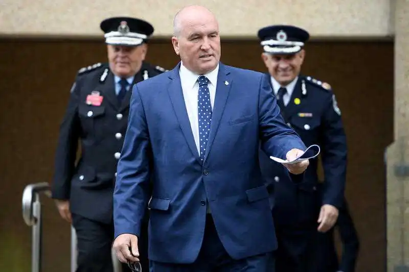 NSW Police Minister David Elliott (centre) arrives at a press conference on Oct. 22, 2020, in Sydney, Australia (AAP Image/Dan Himbrechts) 