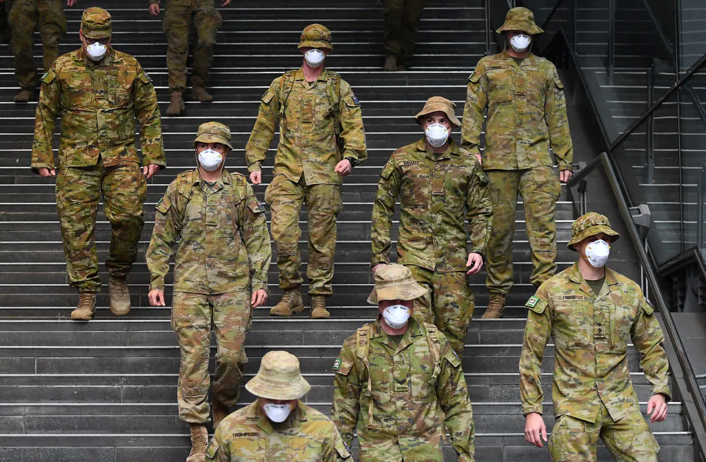Members of the Australian Defence Force walk through the city in Melbourne, Australia, on July 27, 2020. (Quinn Rooney/Getty Images)