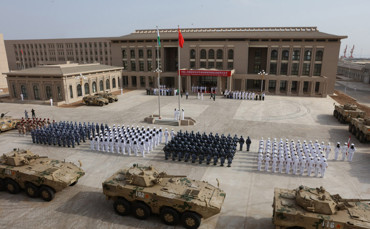 Chinese People’s Liberation Army personnel attend the opening ceremony of China’s new military base in Djibouti on Aug. 1, 2017. (STR/AFP via Getty Image)