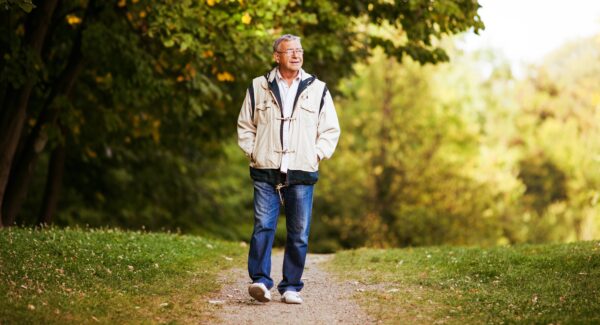 Happy,Senior,Man,Walking,And,Relaxing,In,Park