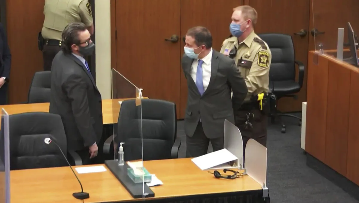 Former Minneapolis Police Officer Derek Chauvin (C) is taken into custody as his attorney, Eric Nelson (L), looks on after the verdicts were read at Chauvin's trial for the 2020 death of George Floyd at the Hennepin County Courthouse in Minneapolis on April 20, 2021. (Court TV via AP, Pool)