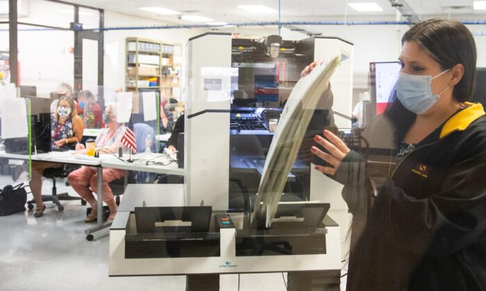 Votes are counted by staff at the Maricopa County Elections Department office in Phoenix, Ariz., on Nov. 5, 2020. (Courtney Pedroza/Getty Images)