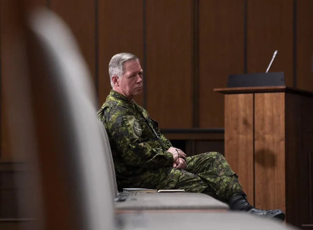 Then-Chief of Defence Staff Jonathan Vance watches a news conference from the front row of seats on May 7, 2020, in Ottawa. The woman at the heart of sexual misconduct allegations against Canada’s former top military commander says Gen. Jonathan Vance believes he is “untouchable. (Adrian Wyld/The Canadian Press)
