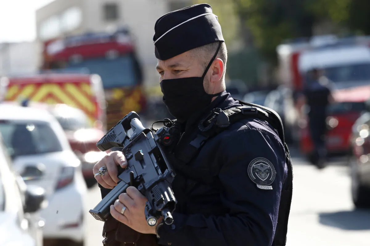 Police officer blocks the access next to the Police station in Rambouillet, south west of Paris, on April 23, 2021. (Michel Euler/AP Photo)