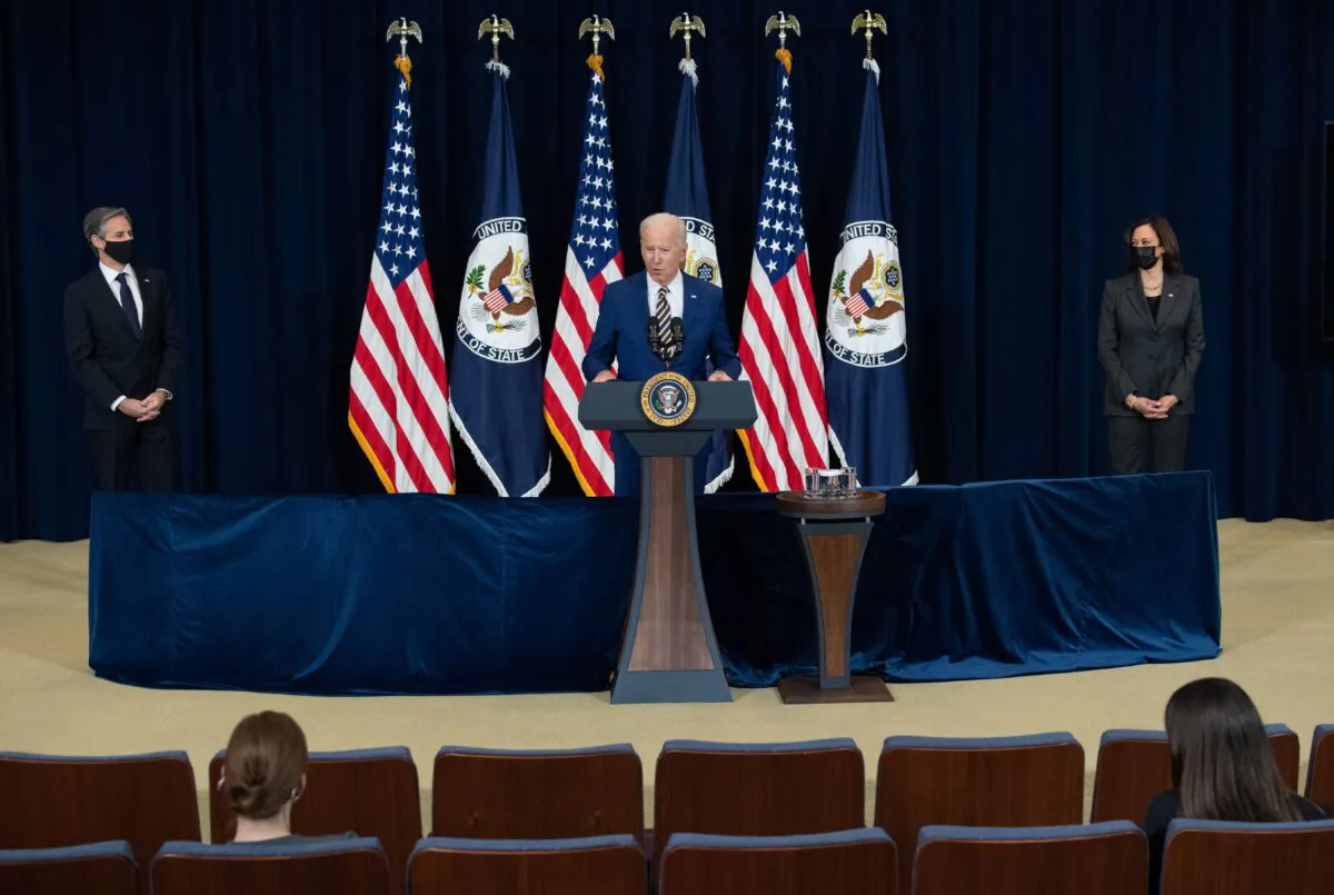 President Joe Biden, with Secretary of State Antony Blinken (L) and Vice President Kamala Harris, speaks to the staff of the U.S. State Department during his first visit in Washington on Feb. 4, 2021. (Saul Loeb/AFP via Getty Images)