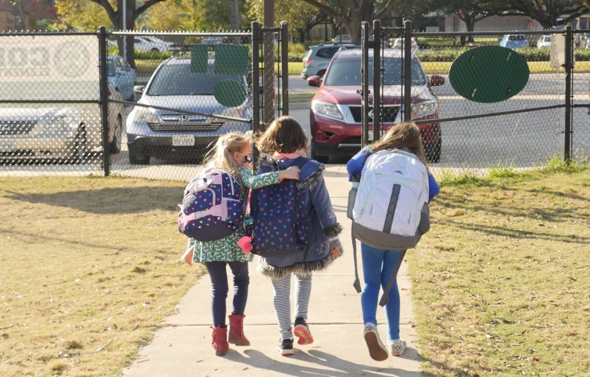 School children walk outside Condit Elementary School in Bellaire, outside Houston, Texas, on Dec. 16, 2020. (François Picard/AFP via Getty Images)