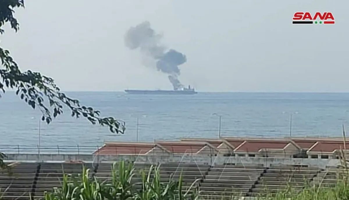 Smoke rises from a tanker off the coastal city of Baniyas, Syria, on April 24, 2021. (SANA/Handout via Reuters)