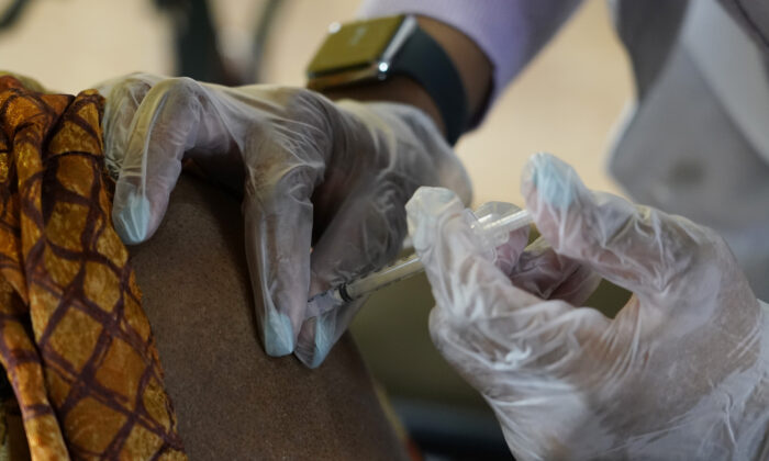 A person gets a COVID-19 vaccine in Jackson, Miss., on Jan. 12, 2021. (Rogelio V. Solis/AP Photo)