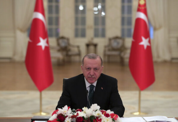 Turkey’s President Recep Tayyip Erdogan listens during the opening session of the virtual global Leaders Summit on Climate, as he sits in his office in Ankara, Turkey, on April 22, 2021. (Mustafa Kamaci/Turkish Presidency via AP)