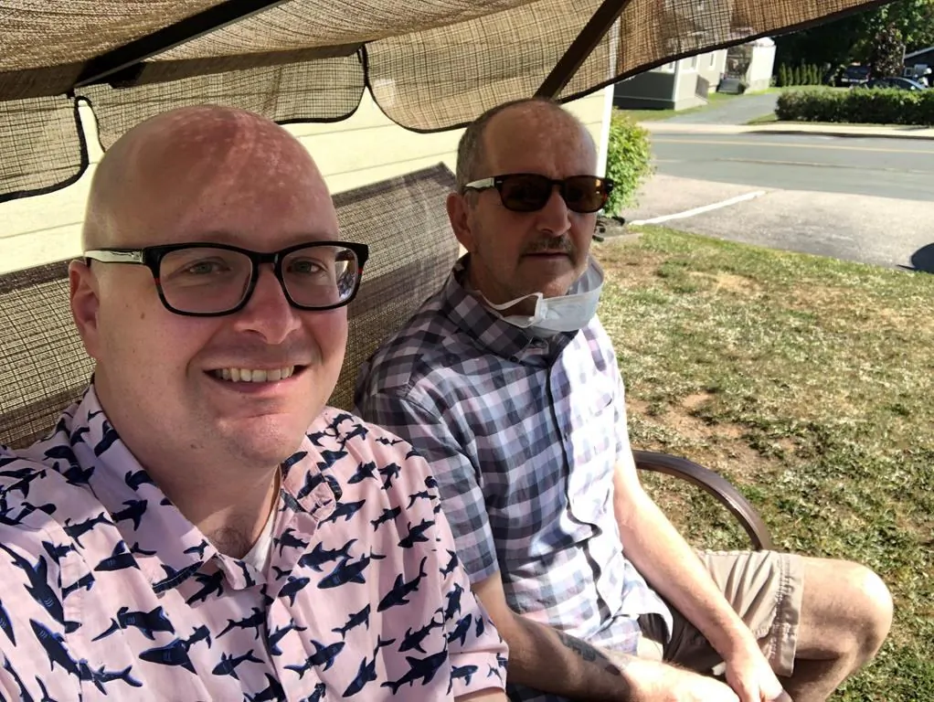 Roger Ellis (R) and his son Steve are shown in a family handout photo. Families of people afflicted with a mysterious neurological syndrome in New Brunswick say they're losing patience waiting for information or even contact from the health officials who are investigating. (The Canadian Press/HO-Steve Ellis)