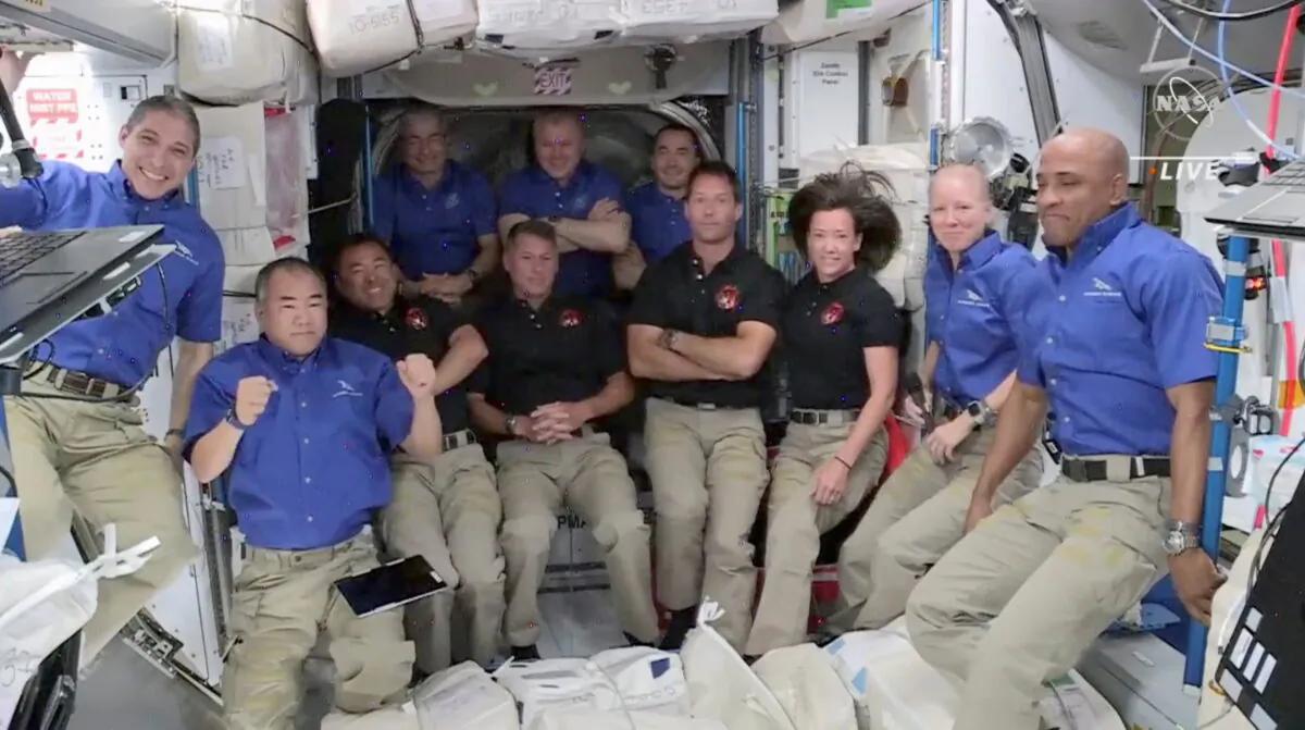 ESA astronaut Thomas Pesquet of France, NASA astronauts Shane Kimbrough and Megan McArthur, and JAXA astronaut Akihiko Hoshide of Japan of Crew 2 assemble with Crew 1 for a welcome ceremony after they arrived aboard the International Space Station, after docking SpaceX's Crew Dragon capsule obiting the earth, on April 24, 2021 in a still image from video. (NASA TV via Reuters)