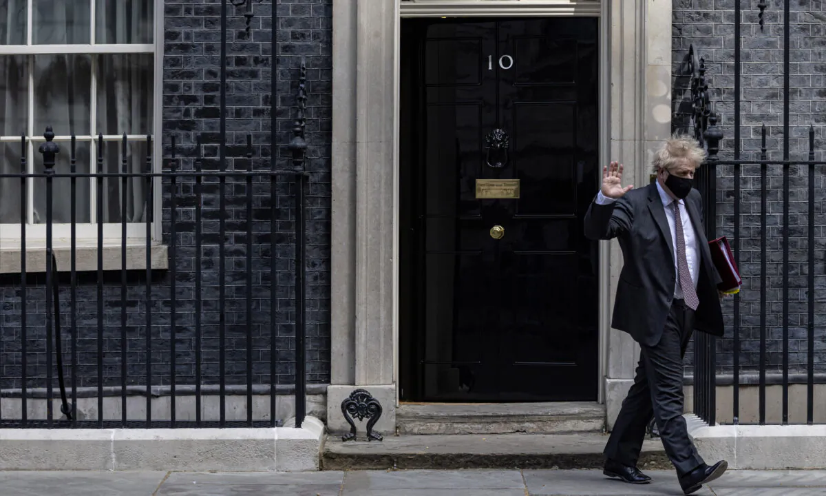 UK Prime Minister Boris Johnson leaves 10 Downing Street to head to Parliament in London on April 21, 2021. (Rob Pinney/Getty Images)