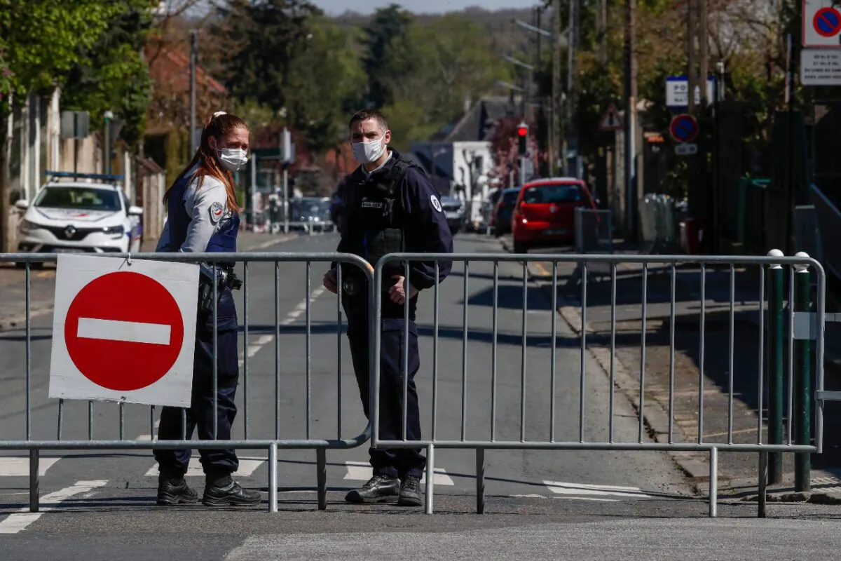 French police officers block the access next to the police station where a police official was stabbed to death Friday in Rambouillet, south west of Paris, France, on Saturday, April 24, 2021. (Michel Euler/AP Photo)