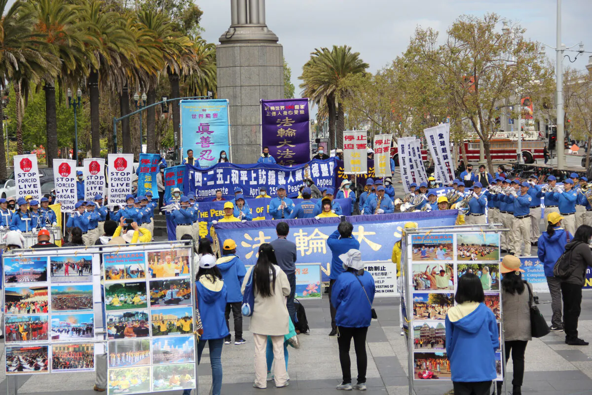 Falun Gong practitioners hold a rally in front of the Ferry Building in San Francisco on April 24, 2021, to raise awareness of the persecution happening in China. (David Lam/The Epoch Times)