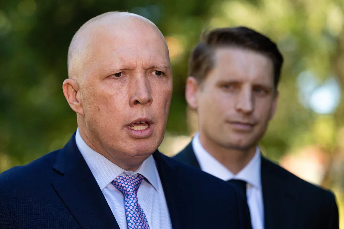 Australian Defence Minister Peter Dutton addresses media as Liberal member for Canning, Andrew Hastie looks on in Perth, Australia on April 19, 2021. (AAP Image/Richard Wainwright)