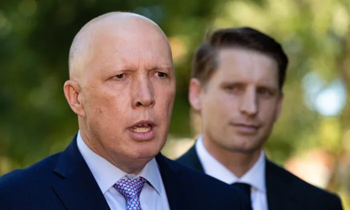 Australian Defence Minister Peter Dutton addresses media as Liberal member for Canning, Andrew Hastie looks on in Perth, Australia on April 19, 2021. (AAP Image/Richard Wainwright) 