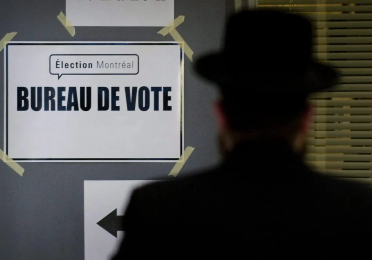 A man arrives at a polling station to cast his ballot in the Montreal municipal elections in Montreal, Canada, on Nov. 1, 2009. (Graham Hughes/The Canadian Press)