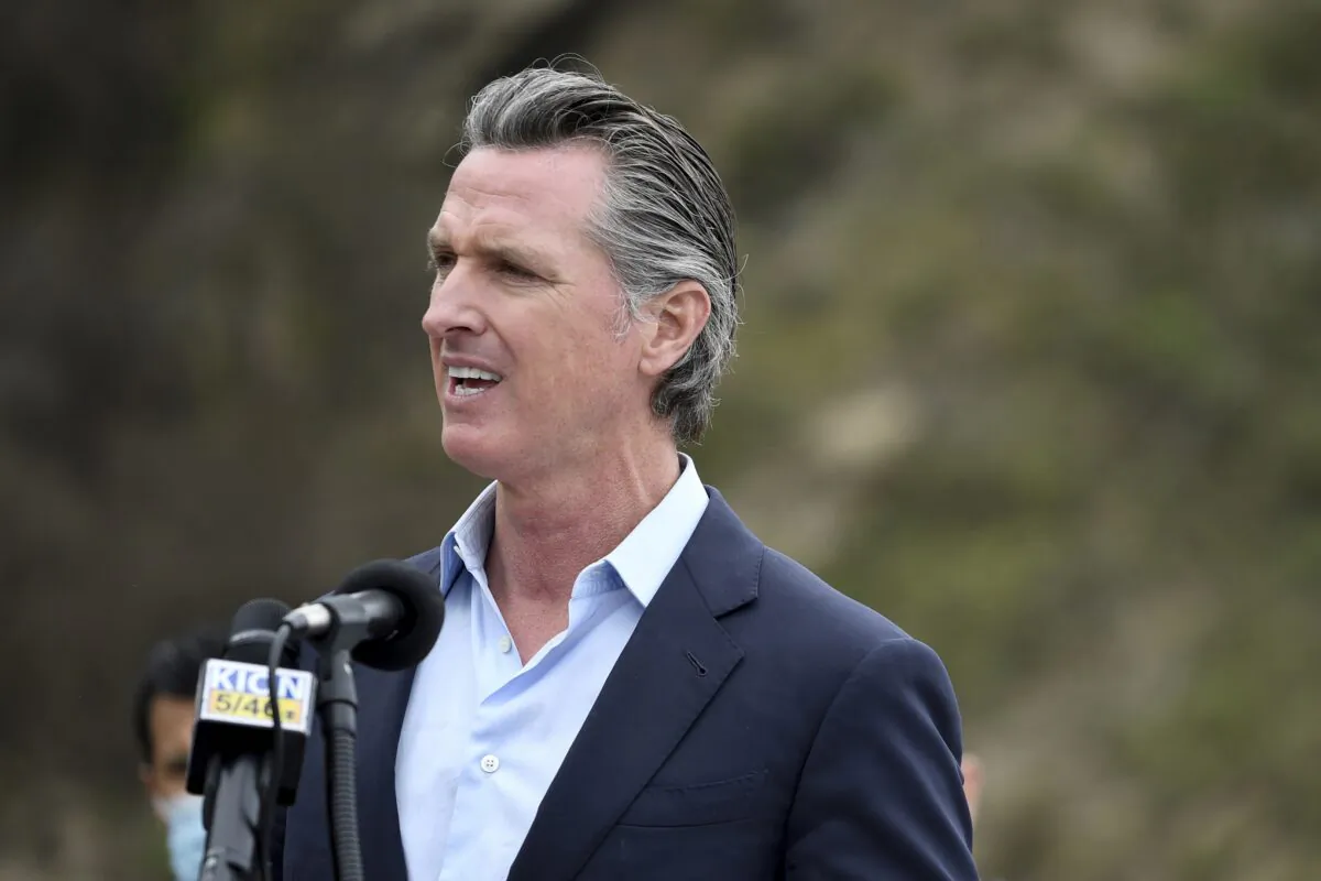 California Gov. Gavin Newsom speaks during a press conference about the newly reopened Highway 1 at Rat Creek near Big Sur, Calif., on April 23, 2021. (Nic Coury/AP Photo)