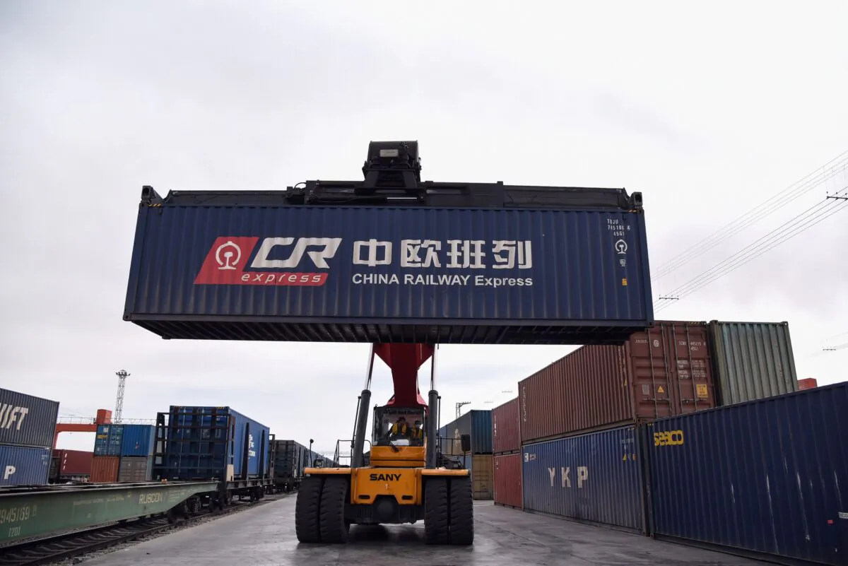A crane transfers a container to a China Railway Express train to Europe in the Chinese border city of Erenhot, Inner Mongolia Region, on April 18, 2019. (STR/AFP via Getty Images)