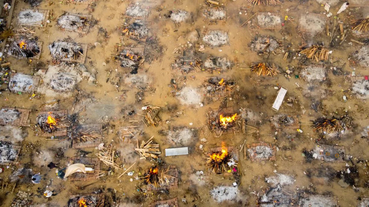 In this aerial photo taken on April 26, 2021, burning pyres of victims who lost their lives due to COVID-19 at a cremation ground in New Delhi. (Jewel Samad/AFP via Getty Images)