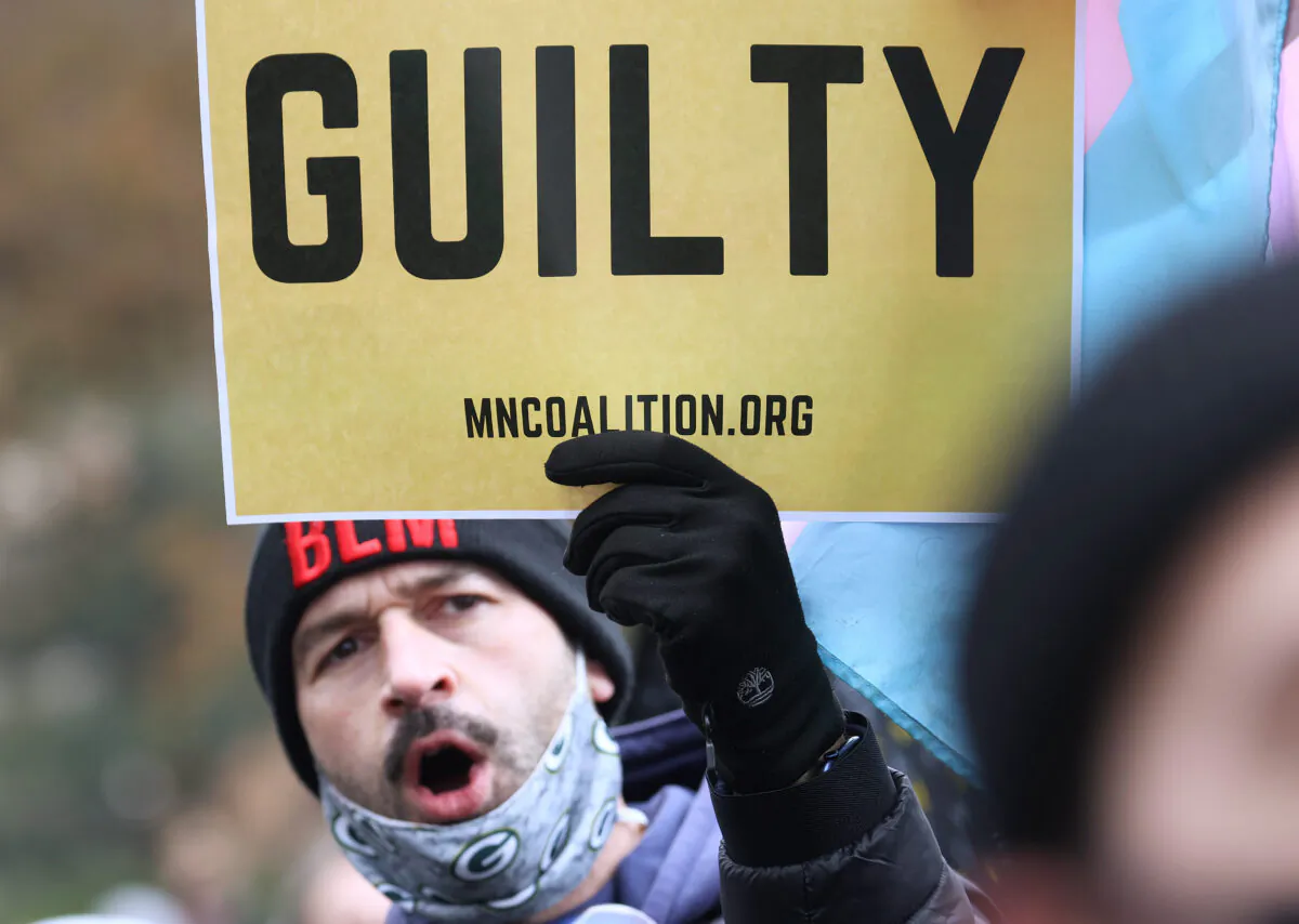 People react after the verdict was read in the Derek Chauvin trial in Minneapolis, on April 20, 2021. (Scott Olson/Getty Images)