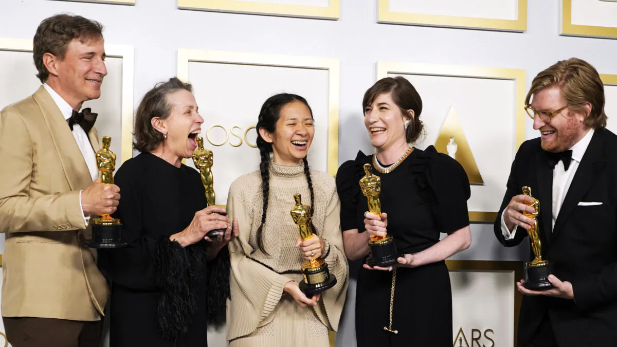 Producers Peter Spears, from left, Frances McDormand, Chloe Zhao, Mollye Asher and Dan Janvey, winners of the award for best picture for "Nomadland," pose in the press room at the Oscars at Union Station in Los Angeles on April 25, 2021. (Chris Pizzello, Pool/AP)

