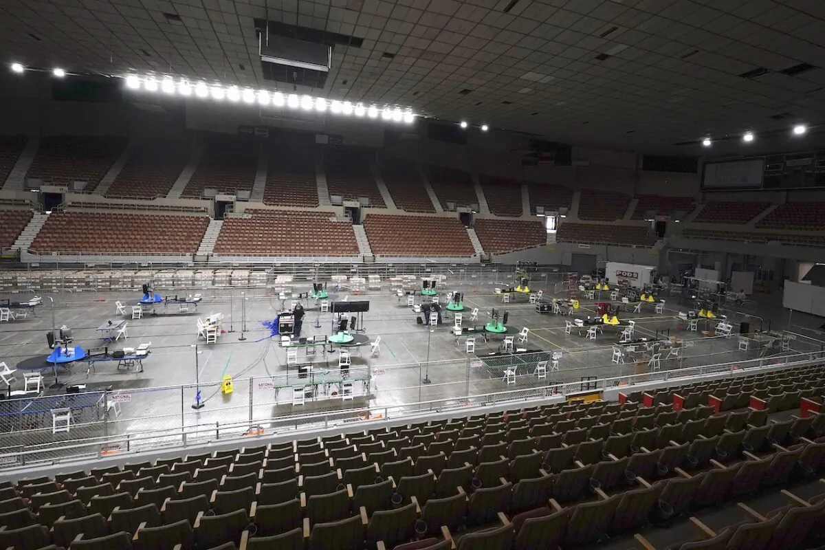 Ordered by the Republican-majority Arizona Senate, ballot scanning equipment is set up at the Arizona Veterans Memorial Coliseum in Phoenix, Arizona, on April 22, 2021. (Ross D. Franklin/AP Photo)
