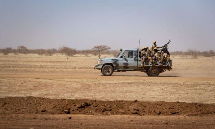 Soldiers patrol aboard a pick-up truck on a road in Burkina Faso, on Feb. 3, 2020. (Olympia De Maismont/Getty Images)
