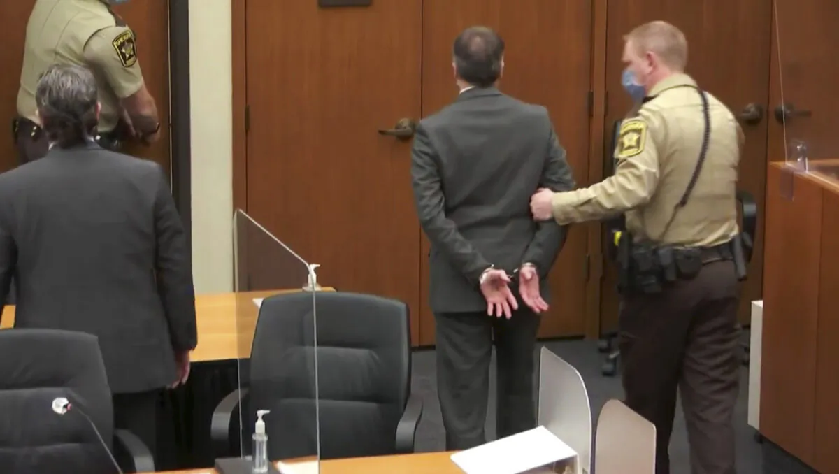 In this image from video, former Minneapolis police Officer Derek Chauvin, center, is taken into custody as his attorney, Eric Nelson, left, looks on, after the verdicts were read at Chauvin's trial for the 2020 death of George Floyd, at the Hennepin County Courthouse in Minneapolis, Minn., on April 20, 2021. (Court TV via AP, Pool)