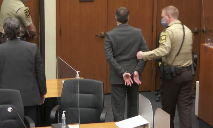 In this image from video, former Minneapolis police Officer Derek Chauvin, center, is taken into custody as his attorney, Eric Nelson, left, looks on, after the verdicts were read at Chauvin's trial for the 2020 death of George Floyd, at the Hennepin County Courthouse in Minneapolis, Minn., on April 20, 2021. (Court TV via AP, Pool)