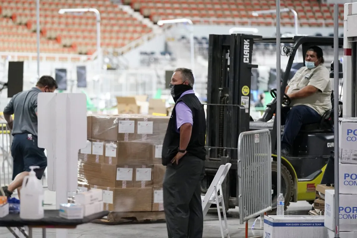Some of the 2.1 million ballots cast during the 2020 election, are brought in for recounting at a 2020 election ballot audit ordered by the Republican lead Arizona Senate at the Arizona Veterans Memorial Coliseum, in Phoenix, Ariz., on April 22, 2021. (Ross D. Franklin/AP Photo)