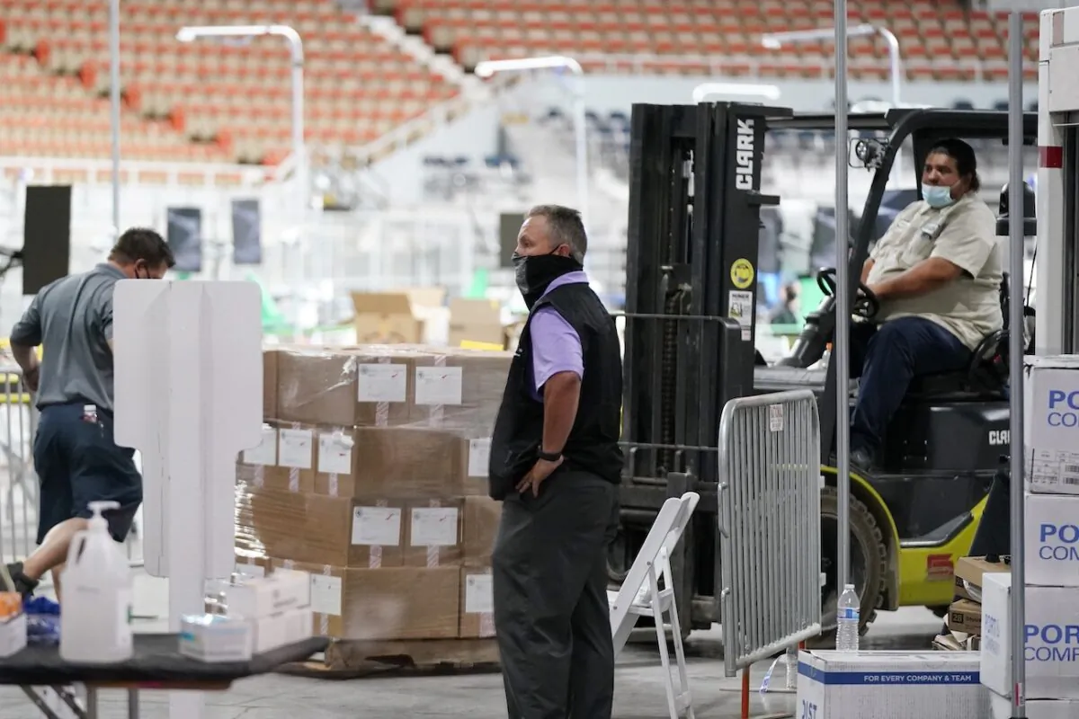 Some of the 2.1 million ballots cast during the 2020 election, are brought in for recounting at a 2020 election ballot audit ordered by the Arizona Senate at the Arizona Veterans Memorial Coliseum, in Phoenix, Arizona, on April 22, 2021. (Ross D. Franklin/AP Photo)