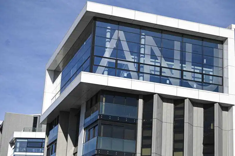The logo of the Australian National University (ANU) is seen on a building at the campus in Canberra, Australia on Sept. 16, 2020. (AAP Image/Lukas Coch)