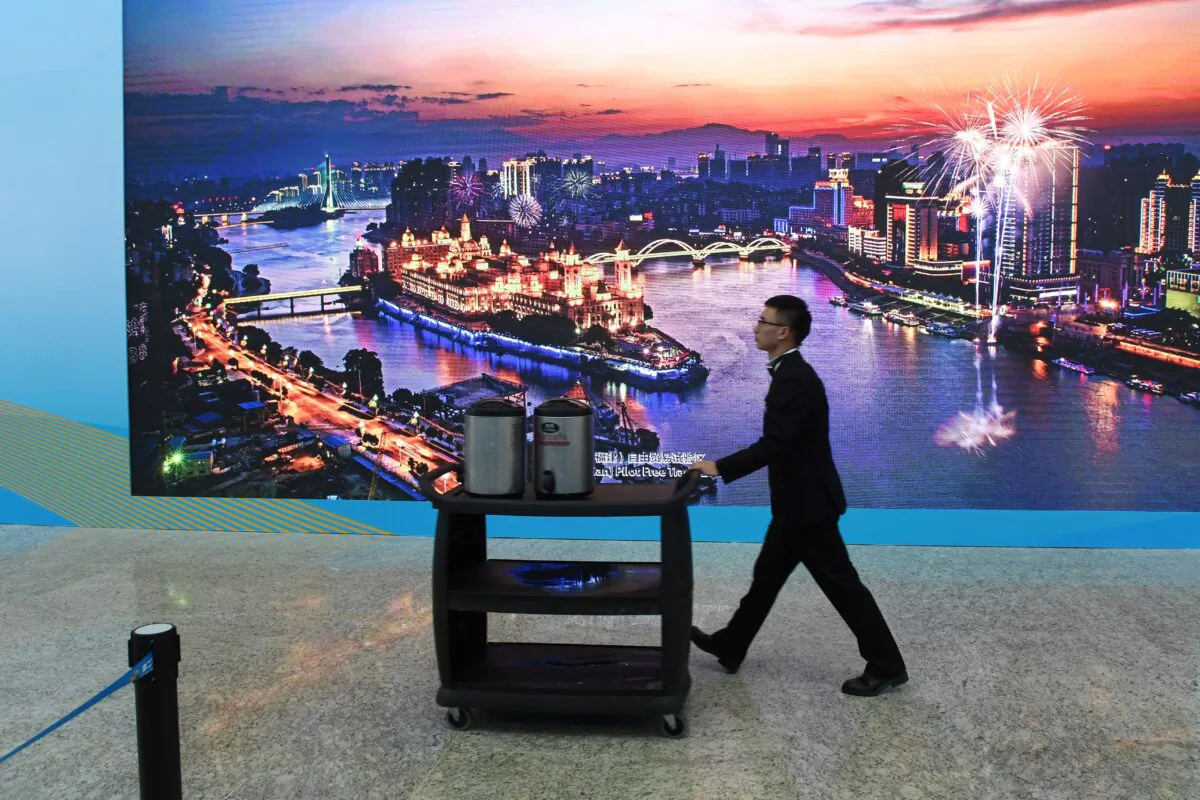 A worker pushes a cart at the venue of the Belt and Road Forum in Beijing on April 26, 2019. (Greg Baker/AFP via Getty Images)
