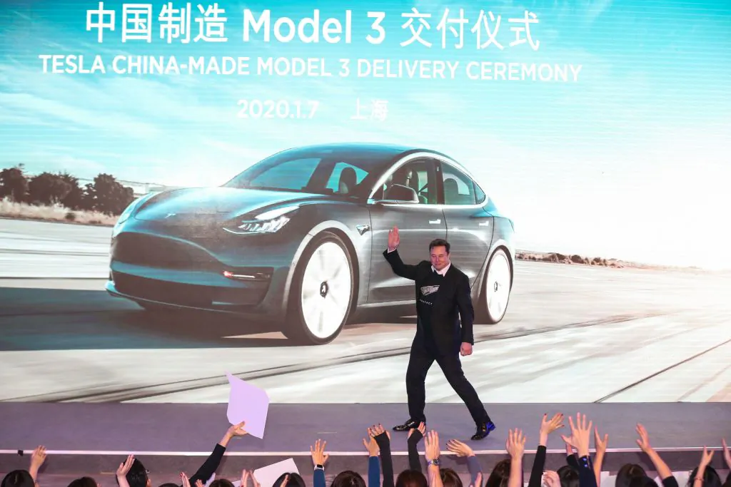 Tesla CEO Elon Musk gestures during the Tesla China-made Model 3 Delivery Ceremony in Shanghai in this undated photo. (STR/AFP via Getty Images)