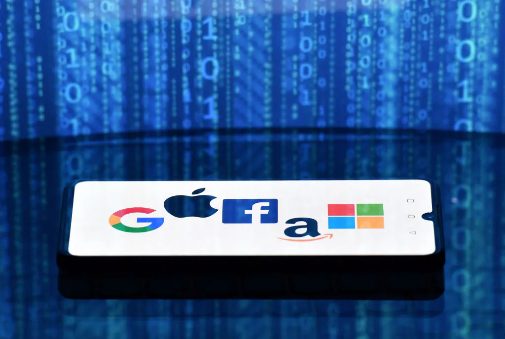 Google, Apple, Facebook, Amazon, and Microsoft logos are displayed on a mobile phone in London, England, on Dec. 18, 2020. (Justin Tallis/AFP via Getty Images)