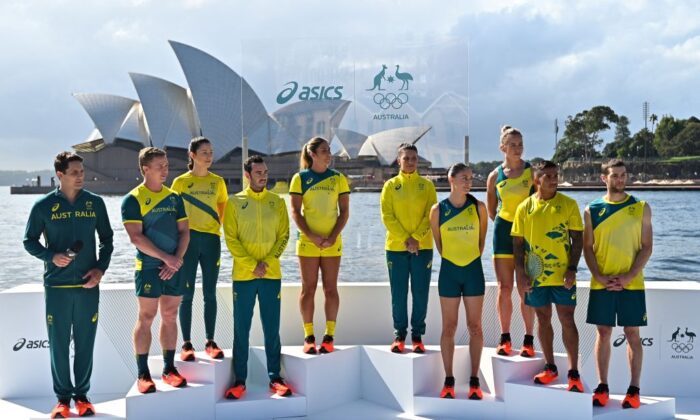 From L-R: Australian athletes AJ Roach, Henry Hutchinson, Marina Carrier, Jake Birtwhistle, Charlotte Caslick, Lisa Darmanin, Katie Ebzer, Lucy Stephan, Maurice Longbottom and Tom O'Halloran pose during the unveiling of the ASICS Australian Olympic Team competition uniforms for the Tokyo 2020 Games in front of the Sydney Opera House on March 31, 2021. (Steven Saphore/ Getty Images)