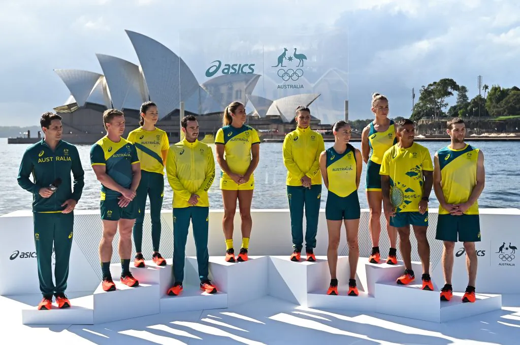 From L-R: Australian athletes AJ Roach, Henry Hutchinson, Marina Carrier, Jake Birtwhistle, Charlotte Caslick, Lisa Darmanin, Katie Ebzer, Lucy Stephan, Maurice Longbottom and Tom O'Halloran pose during the unveiling of the ASICS Australian Olympic Team competition uniforms for the Tokyo 2020 Games in front of the Sydney Opera House on March 31, 2021. (Steven Saphore/ Getty Images)